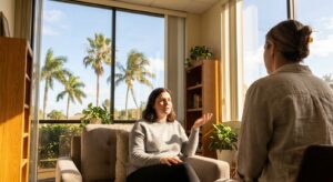 Person in therapy session at recovery center in Port St. Lucie discussing relapse prevention skills with therapist in naturally-lit office